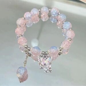 Pink iridescent beaded stretch butterfly charm bracelet